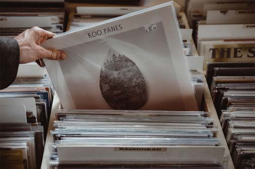 Man pulling record out of record rack