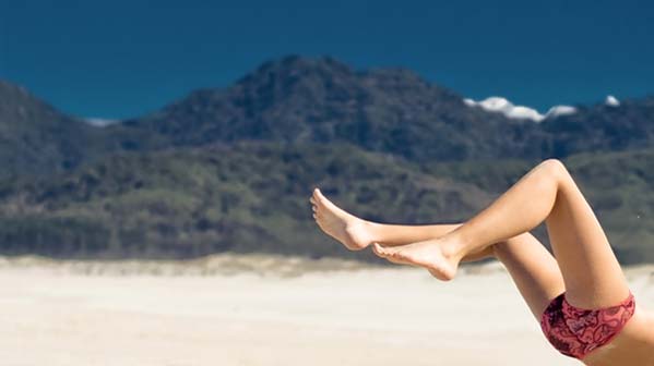 Legs on a beach