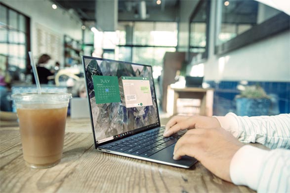 Using a laptop in a cafe