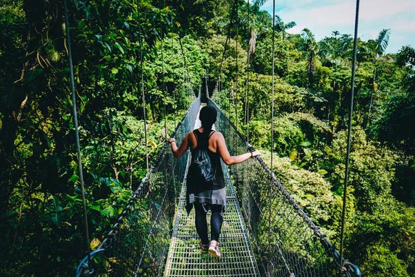 Woman on rope bridge