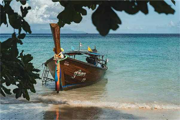 A boat on a tropical islan beach