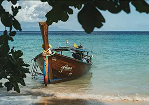 A boat on a tropical islan beach