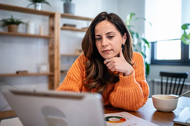 Woman staring at her laptop